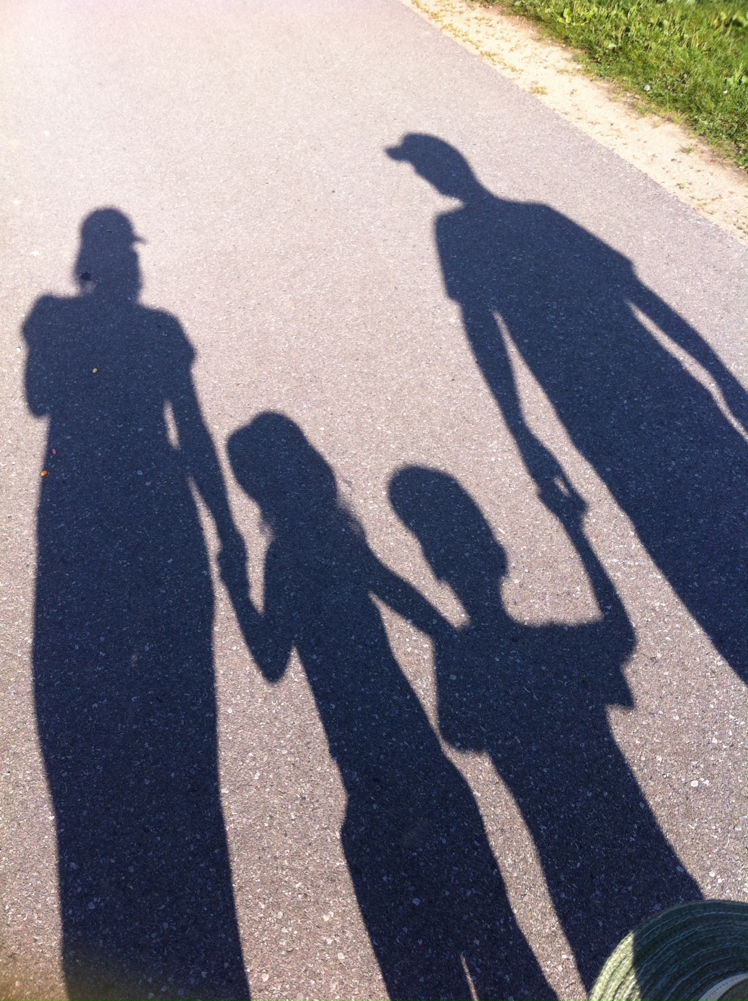 Four shadows on a summer road
